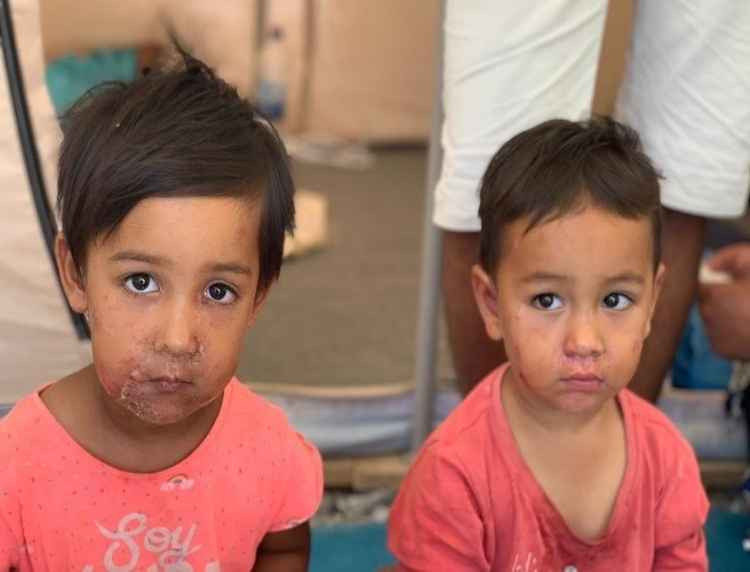 Two refugee children from the camp