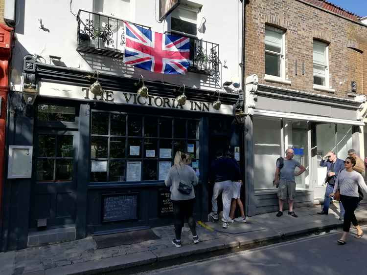 People queuing up for a takeaway pint at the Victoria Inn