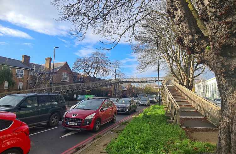 Traffic under the bridge on Chertsey Road A316