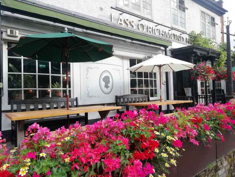 Flowery entrance to the Lass O'Richmond on Queen's Road