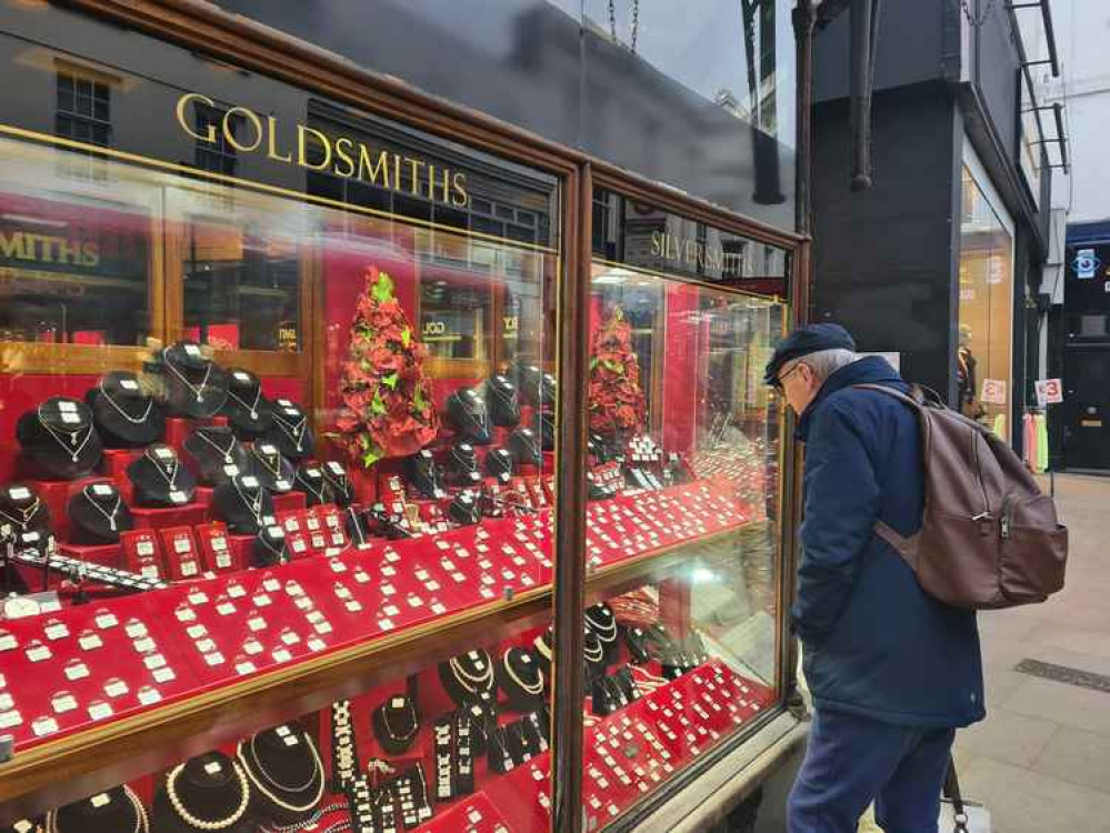 Shoppers taking a peek into Corlander jewellers' display