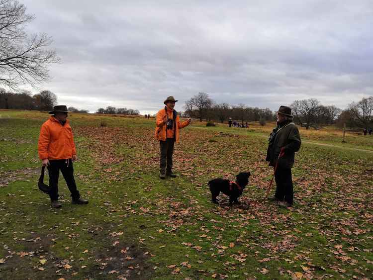 Volunteer Rangers speaking with a visitor to Richmond Park