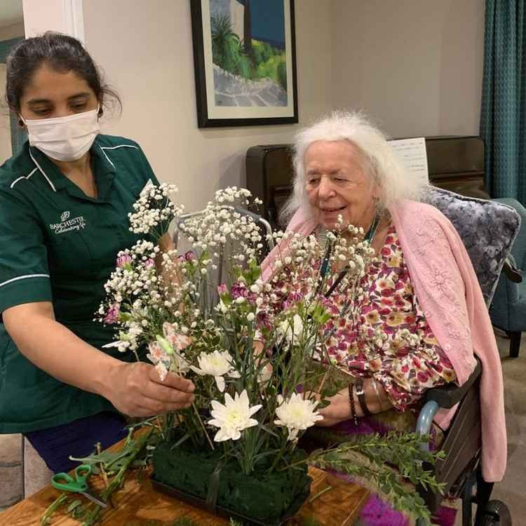 Lynde House resident flower arranging