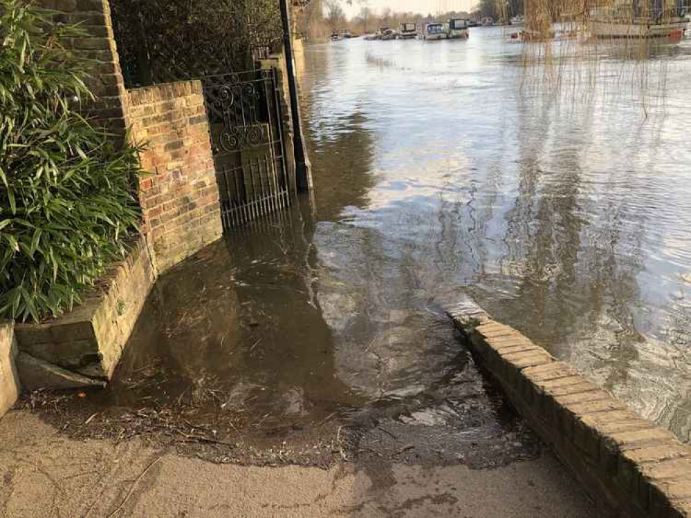 Tide encroaching on the footpath