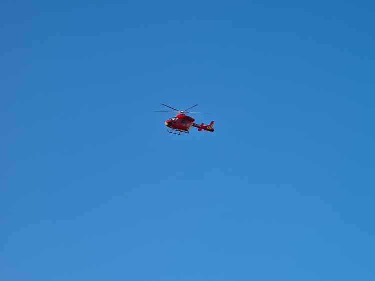 Air ambulance helicopter flying over Old Deer Park