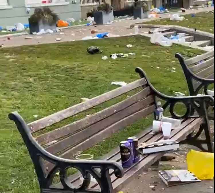 Rubbish left on benches and all over the grass and paths