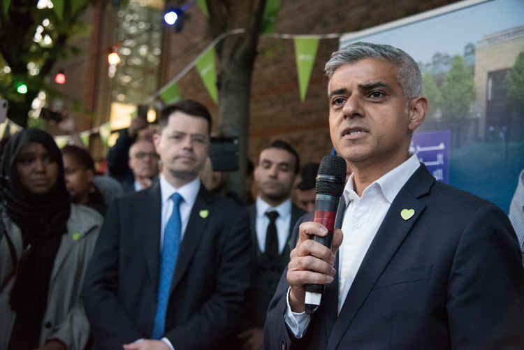 Communities secretary James Brokenshire watches London Mayor Sadiq Khan at Al-Manaar Mosque Grenfell Commemorative street iftar 2019