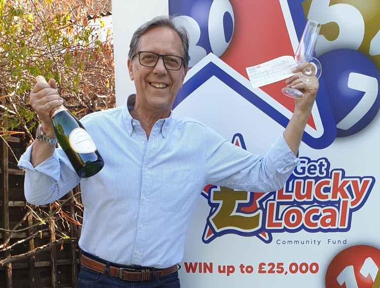 Paul Shields celebrating after his £2000 Get Lucky Local lottery win