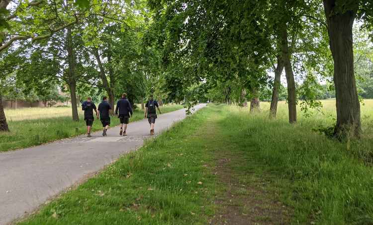 Film crew walk through Ham House's beautiful paths after a long day filming (Credit: Nub News)