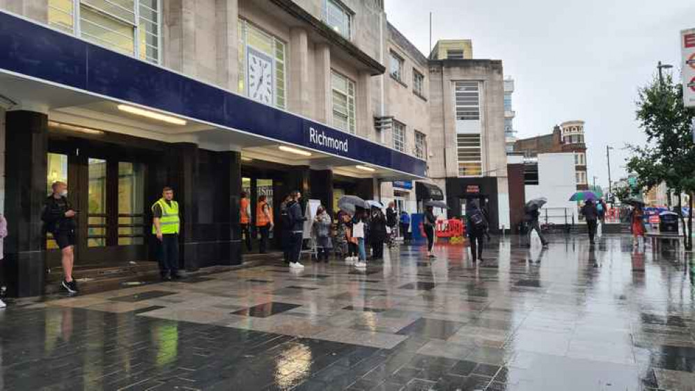 Commuters in the rain outside Richmond Station (Image: Sam Petherick)