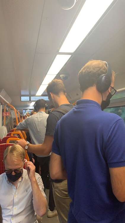 Many commuters packed onto a train while still being told to 'keep socially distanced'. Credit: Penny Anderson.