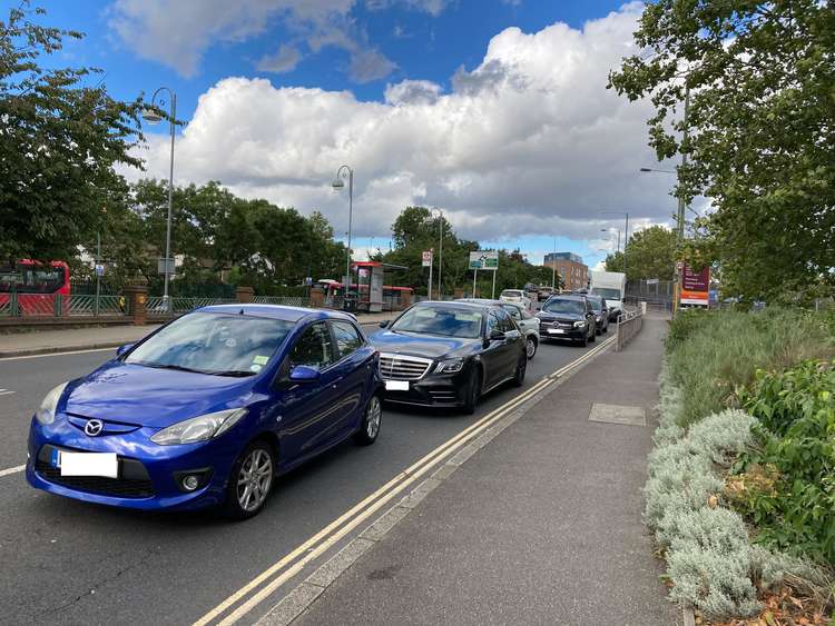 Cars queuing down Manor Road. Credit: James Mayer.