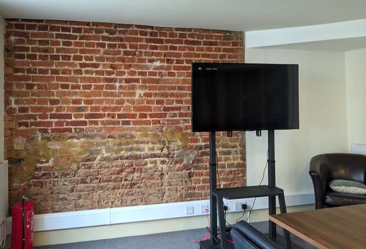 Exposed brickwork in the ground floor meeting room (Image: Ellie Brown)