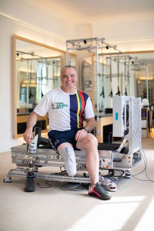 Former Royal Marine Lee Spencer tests astronaut exercise machine in Teddington