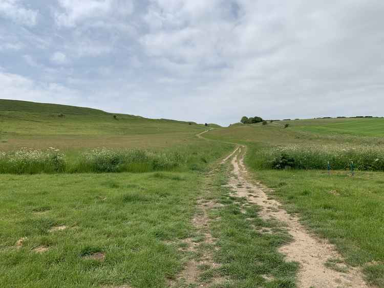 Take the path to the right of Maiden Castle from the car park