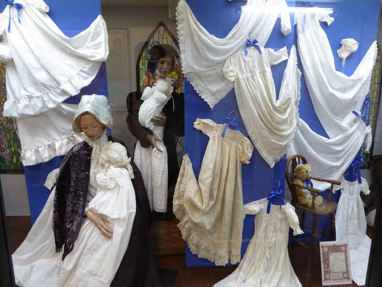 A display of christening robes at the museum