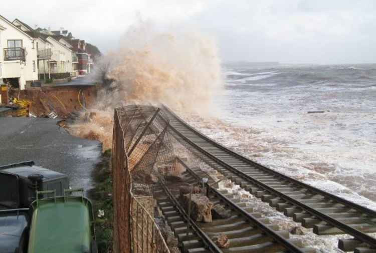Waves crashing over the railway track