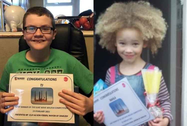 TJ and Nahla with their winners' certificates