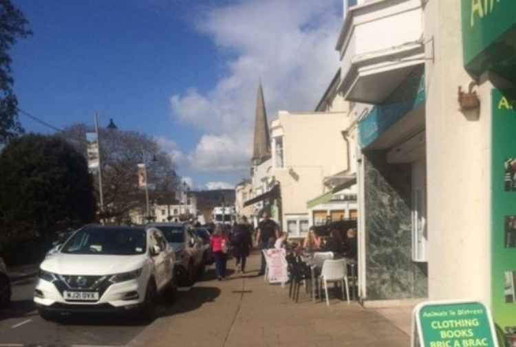 People sitting outside in the town centre