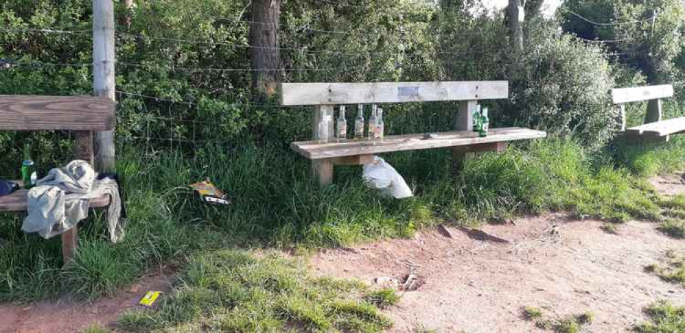 Around 12 glass bottles, together with cardboard boxes, plastic bags, and a jacket, were all discovered on and around the benches at the beauty spot