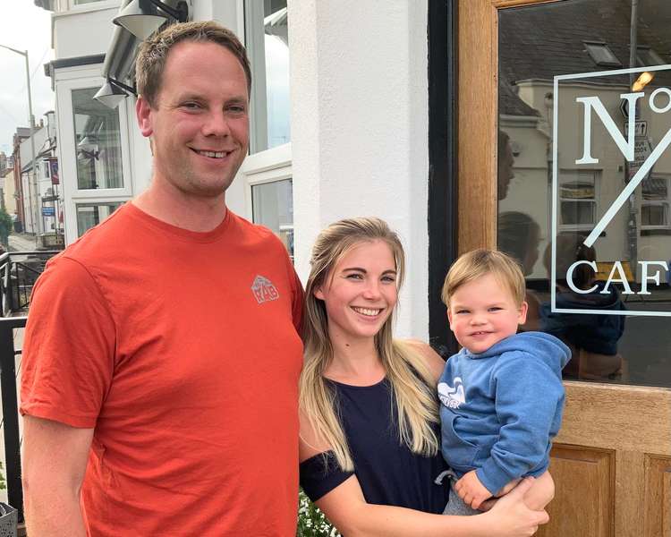 Owners Byron and Kimberley, with their son Atlas, outside No.1 Café on Queen Street