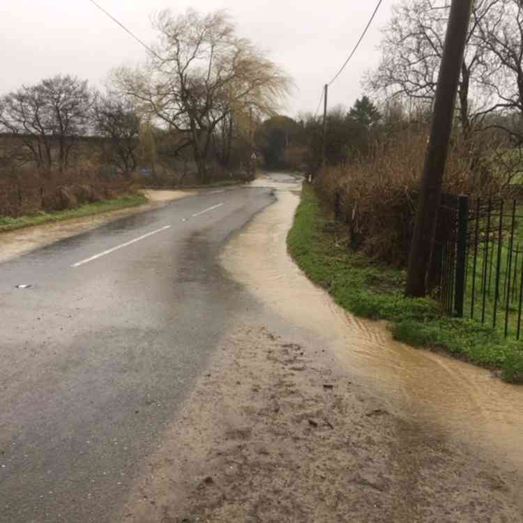 Cars manage to pass on the road to Mells from Frome, but it was later blocked by a fallen tree