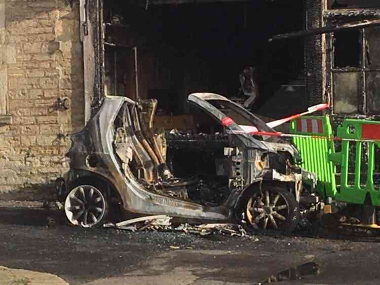 This was the burnt-out car outside the butcher's shop on February 14