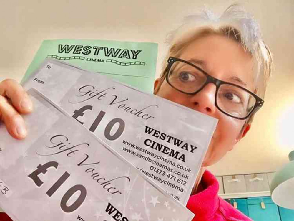 Suzy with the set of vouchers to be taken to Fair Frome