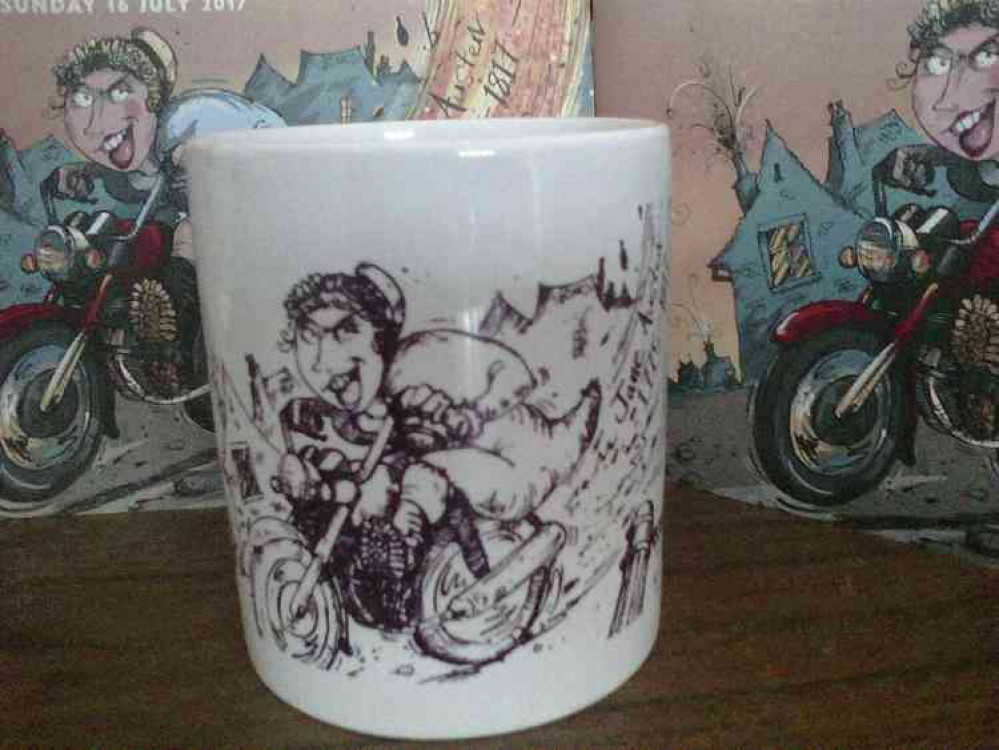 Runners up get this fabulous mug: Festival mugs with this year's amazing design by Sholto of Jane Austen on a motorbike riding through Frome.