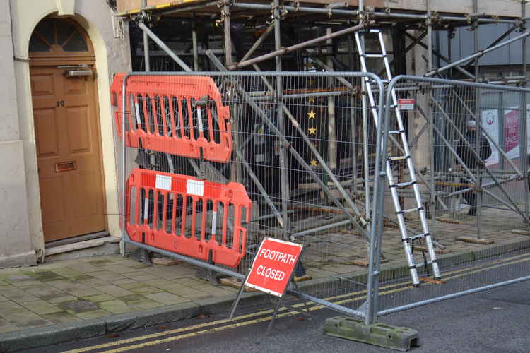 The road and the pavement alongside this Bath Street address are cordoned off