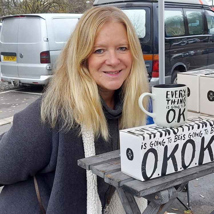 It is also market day in Frome; This stall holder could have sold these mugs ten times over