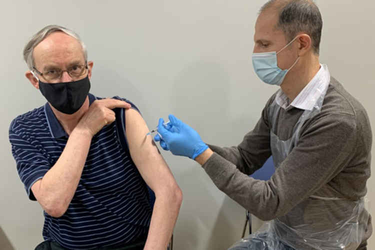 Patient Philip Goodland receiving his vaccination from Dr Toci