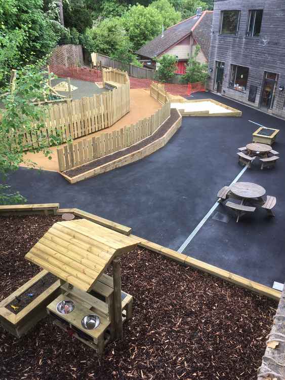 The newly developed outdoor space has areas for mud and water play, climbing, planting flowers and vegetables