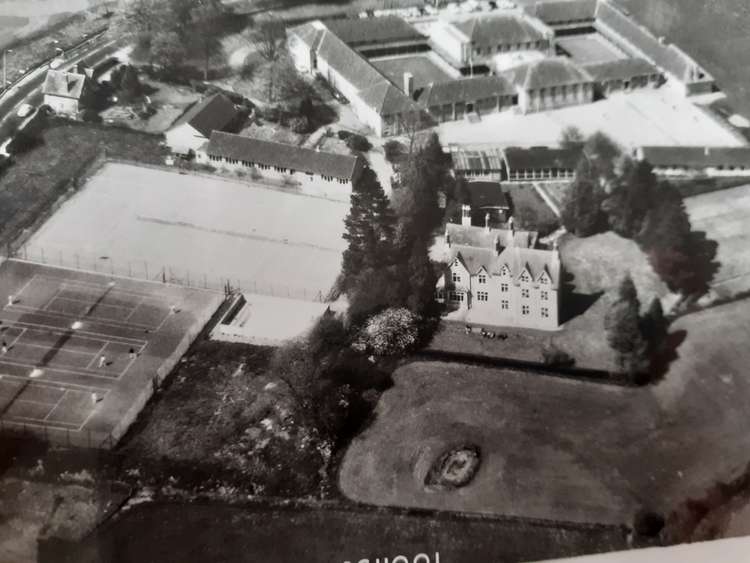 An archive aerial shot of the site and G Block