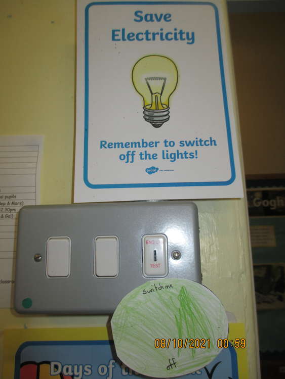 New signs in the school reminding pupils to turn off those lights