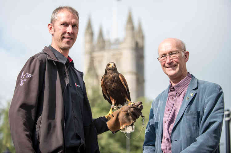 From left, Harvey Pinniger, NBC Environment with Murray the Harris Hawk and Councillor Paul Crossley, Bath and North East Somerset Council