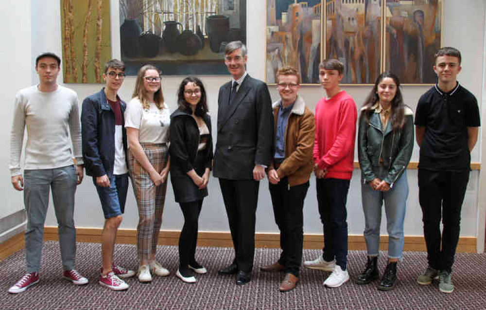 From left, Cristian Muresan (politics), Marcus Boatwright (economics), Holly Anne Thornton (law), Ellie Brown (politics), MP Jacob Rees-Mogg, Charlie Bowles (politics), Oliver Fletcher (politics), Orla Donoghue (politics) and Sam Neath (law)