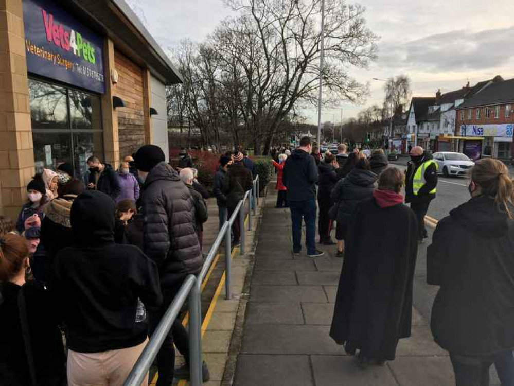 People waiting to be tested at Greasby Library yesterday