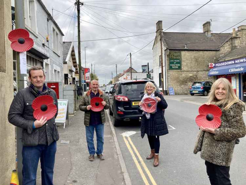 Peasedown Community Trust Chairman Gavin Heathcote, Ferdo Dizdarevic, Cllr Karen Walker and Cllr Sarah Bevan put up poppies throughout Bath Road, Peasedown St John, to honour and remember the village's war heroes.