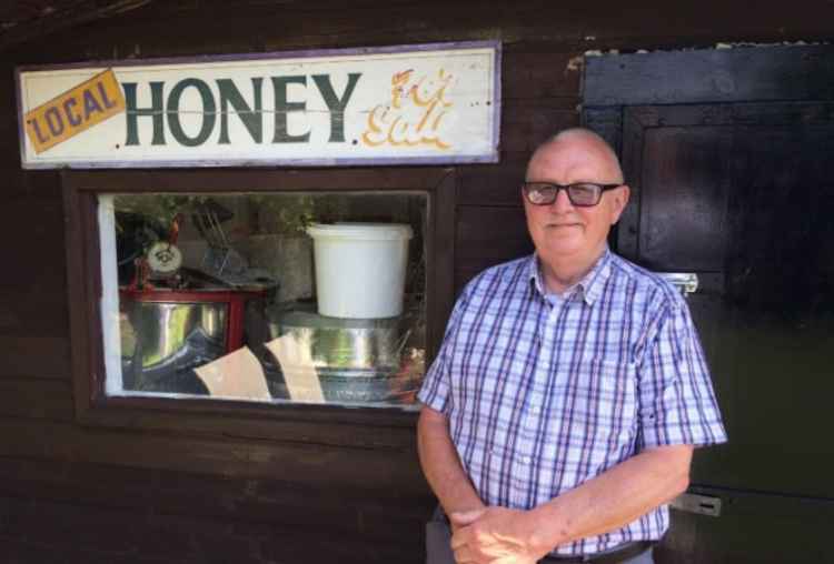 Doug with the sign that once adorned his milk float