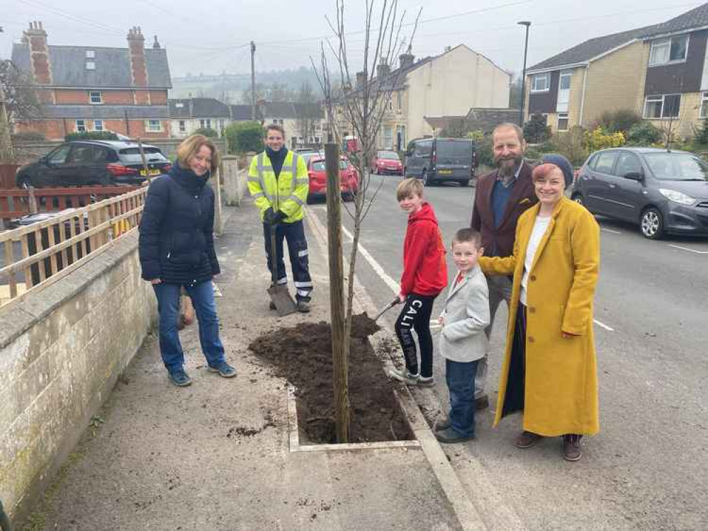 Tree planting on Rosslyn Road. (Left to right) Prue Richardson  - resident   Lee Humphries - B&NES Parks Department, James and Emma Dyke and their children - residents