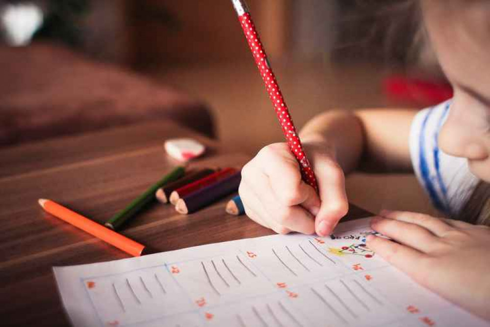 A stock image of a child studying. Permission for use by all partners.