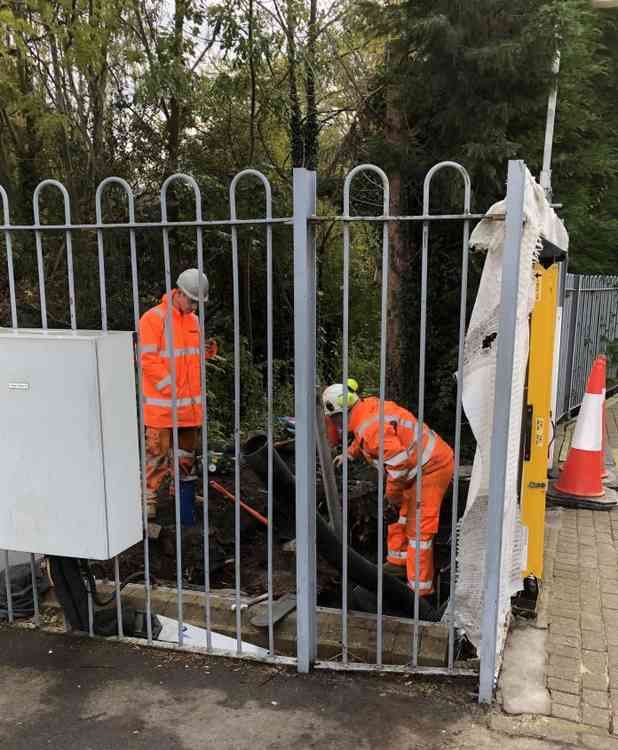 Workmen removing trees close to the station