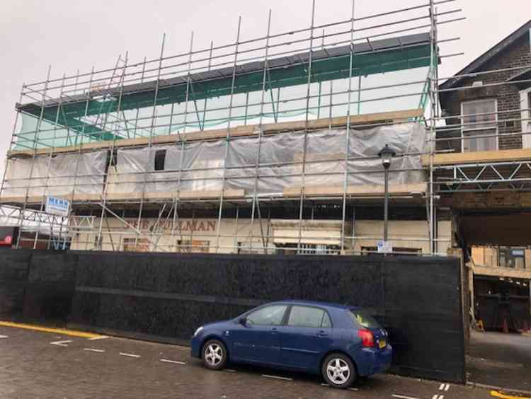 Pictures taken today (Tuesday, 26 November) show work is far from complete but new flats are being added to the facade behind the former Pullman pub.