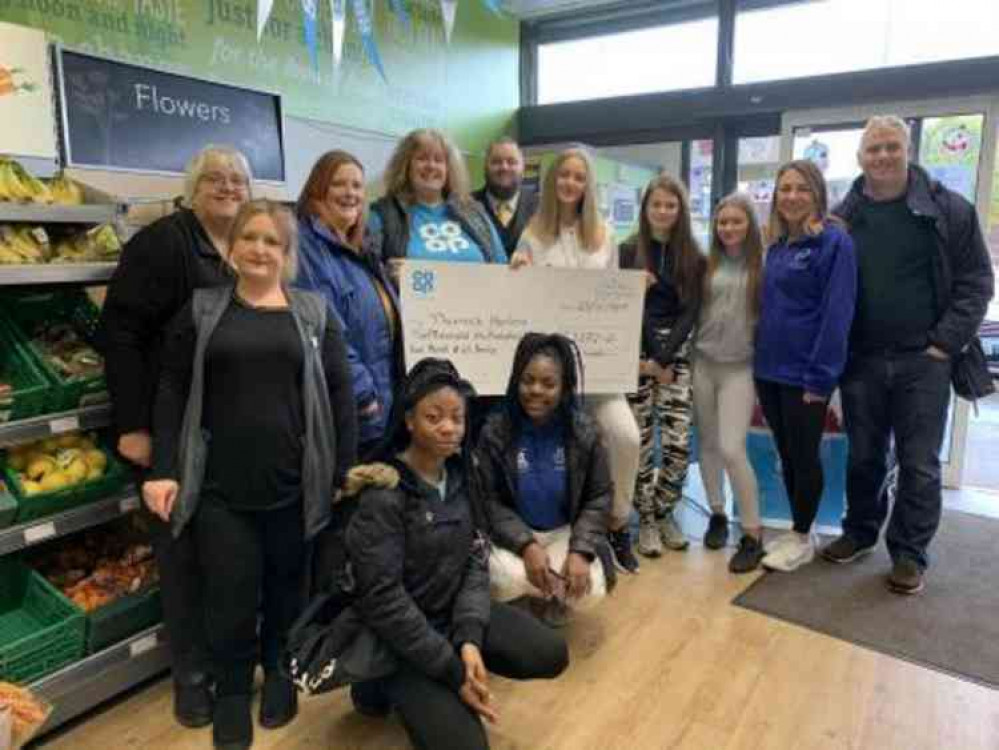 Store staff and members of Thurrock Harriers