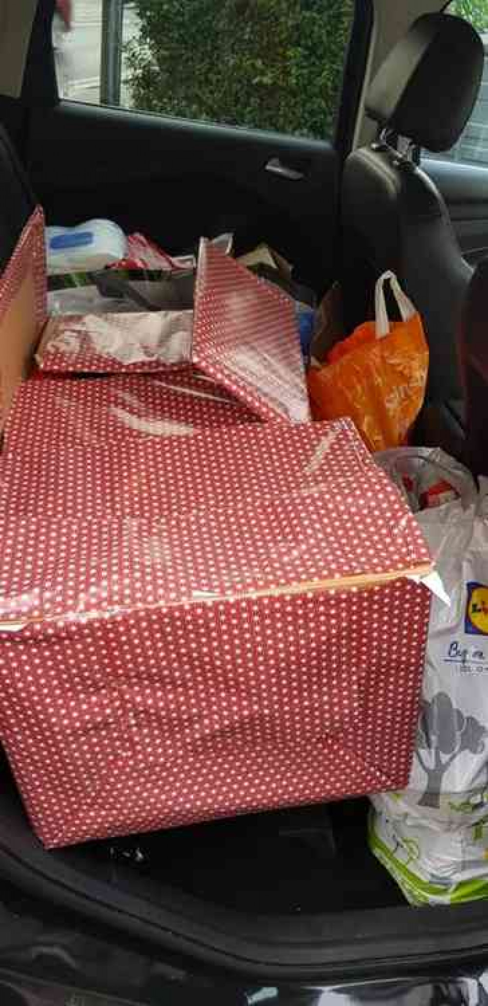 The car load of goods goes off to make a family's Christmas all the more special