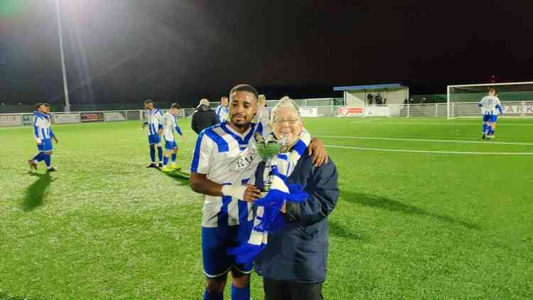 Sue Yates presents Shad Ngandu with the Ron Lowe man of the match award.