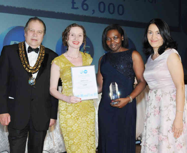 Chafford Hundred 180 Project receive their £6,000 donation.  From left: Thurrock Mayor Terry Piccolo, Elle Knight and Michelle Safo (180 Project) and Adina Pascu P&G site leader.