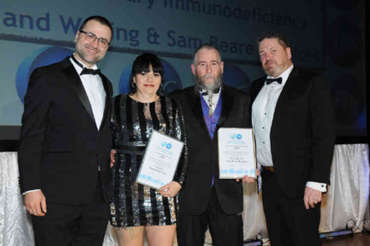 Employee nominee awards were presented to the Primary Immunodeficiency charity and Woking & Sam Beare Hospice and Wellbeing Care. Pictured (from left) are Ozcan Makinaci, Jane Coope, Martin Helmore and Dave Elliott.