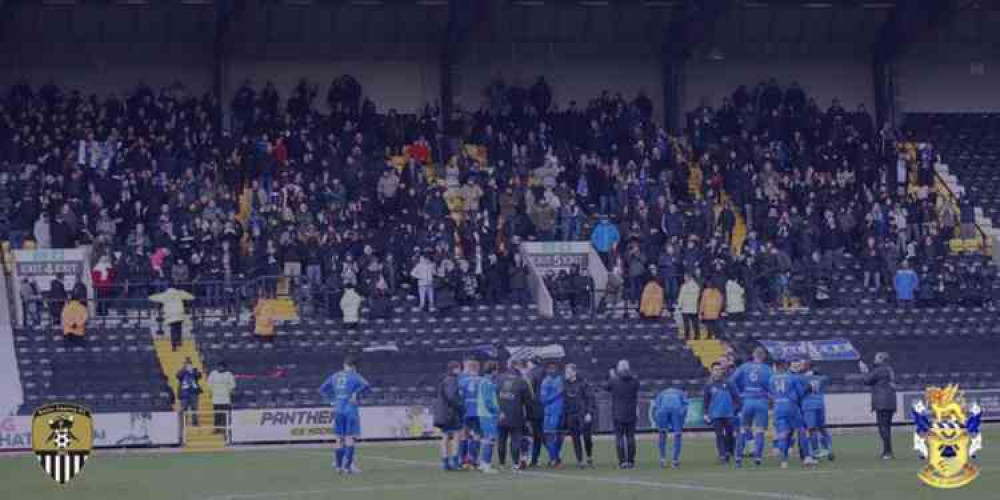 Aveley players applaud their fans at the end.